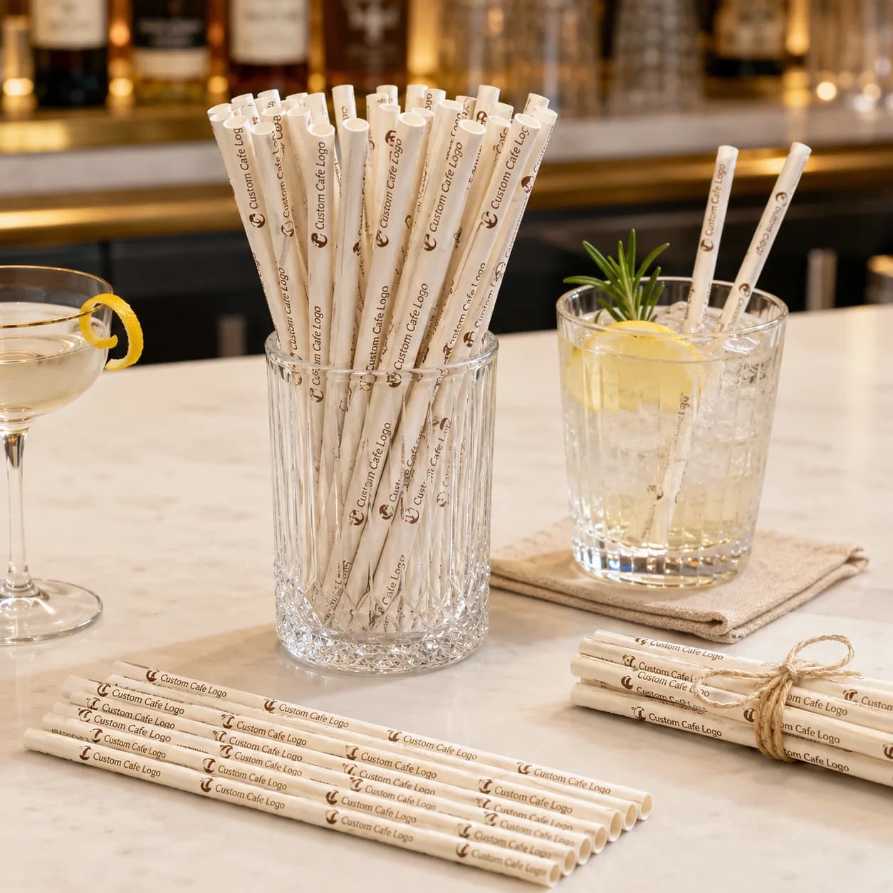 Illustrative custom printed paper straws shown with cold drinks and café service