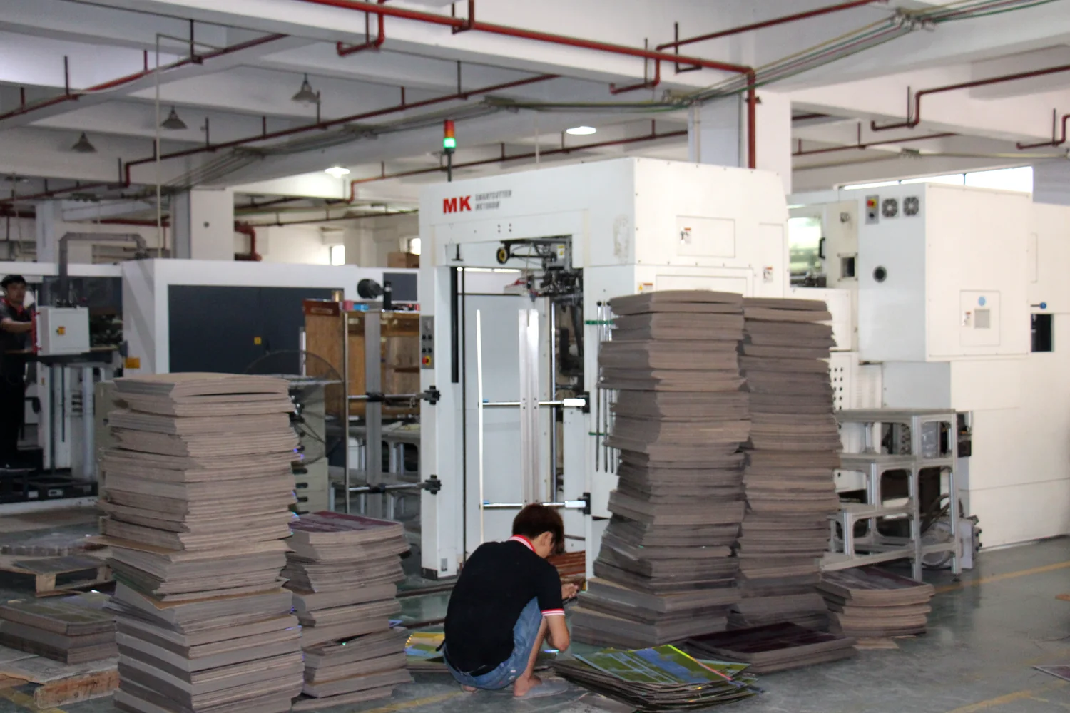 Paperboard stacks and partner cutting equipment for folded food boxes
